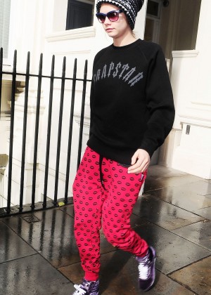 Cara Delevingne in Red Sweats Leaving her house in London