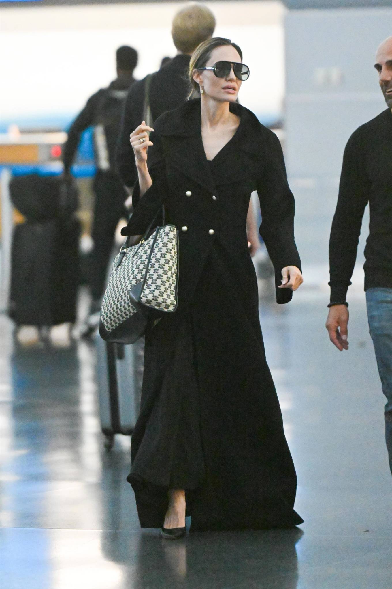 Angelina Jolie 2023 : Angelina Jolie – Carrying a Dior handbag at JFK Airport in New York-05