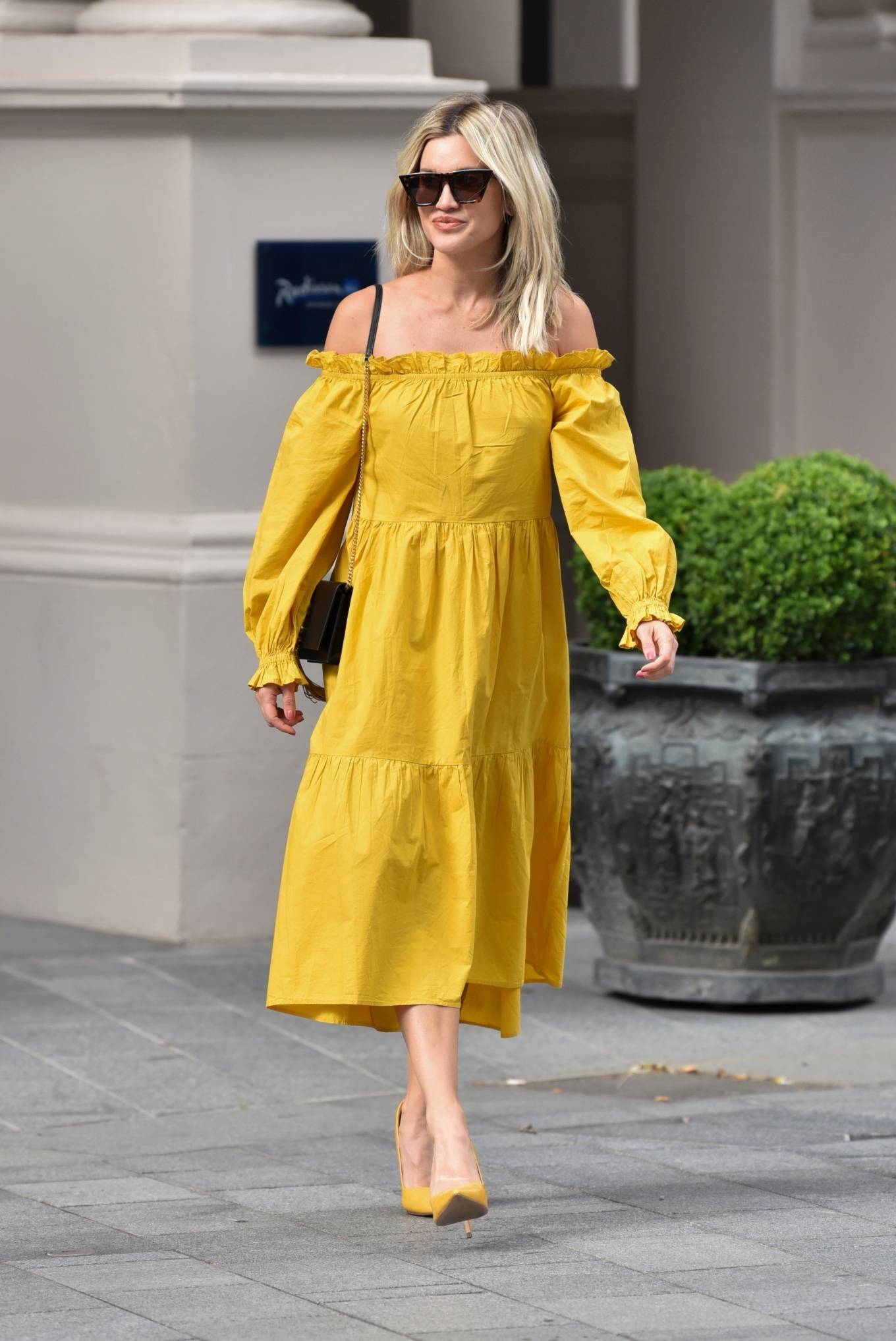 Ashley Roberts – Wears mustard yellow River Island dress in London