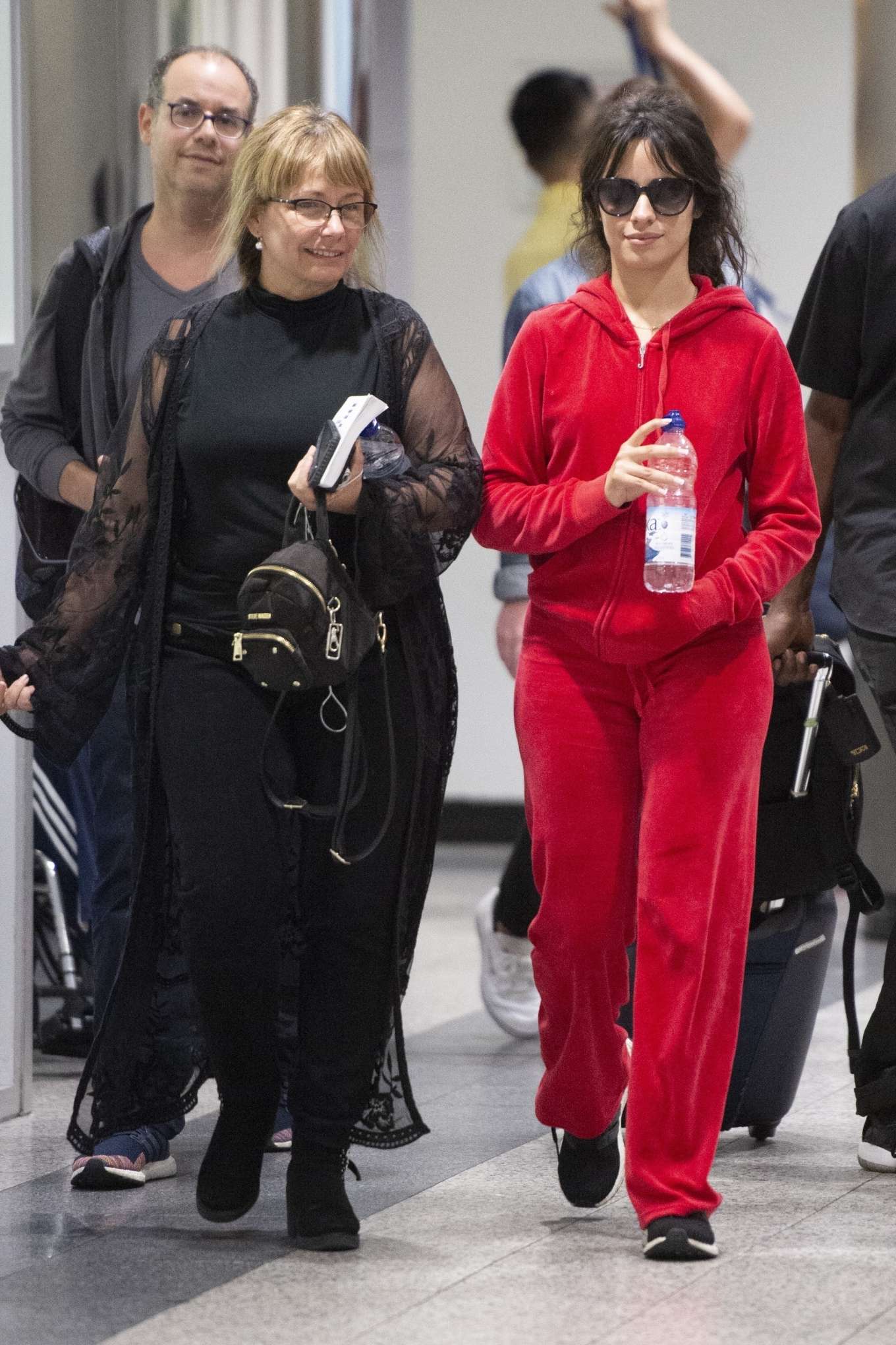 Camila Cabello â€“ All in red at airport with her mother in New York