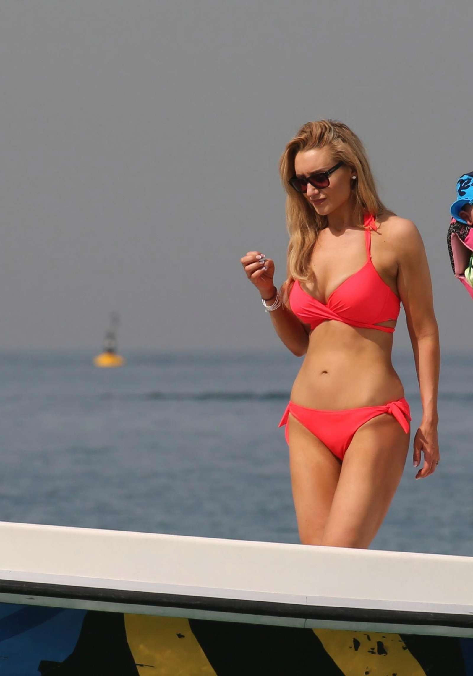 Catherine Tyldesley in Red Bikini on the beach in Dubai | GotCeleb