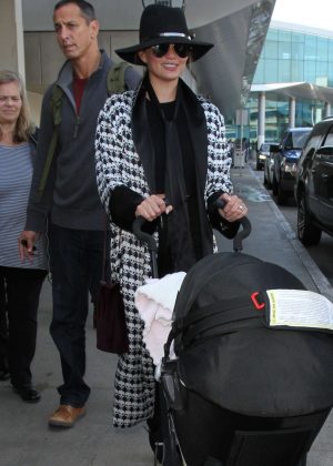 Chrissy Teigen - Arrives at LAX Airport in LA