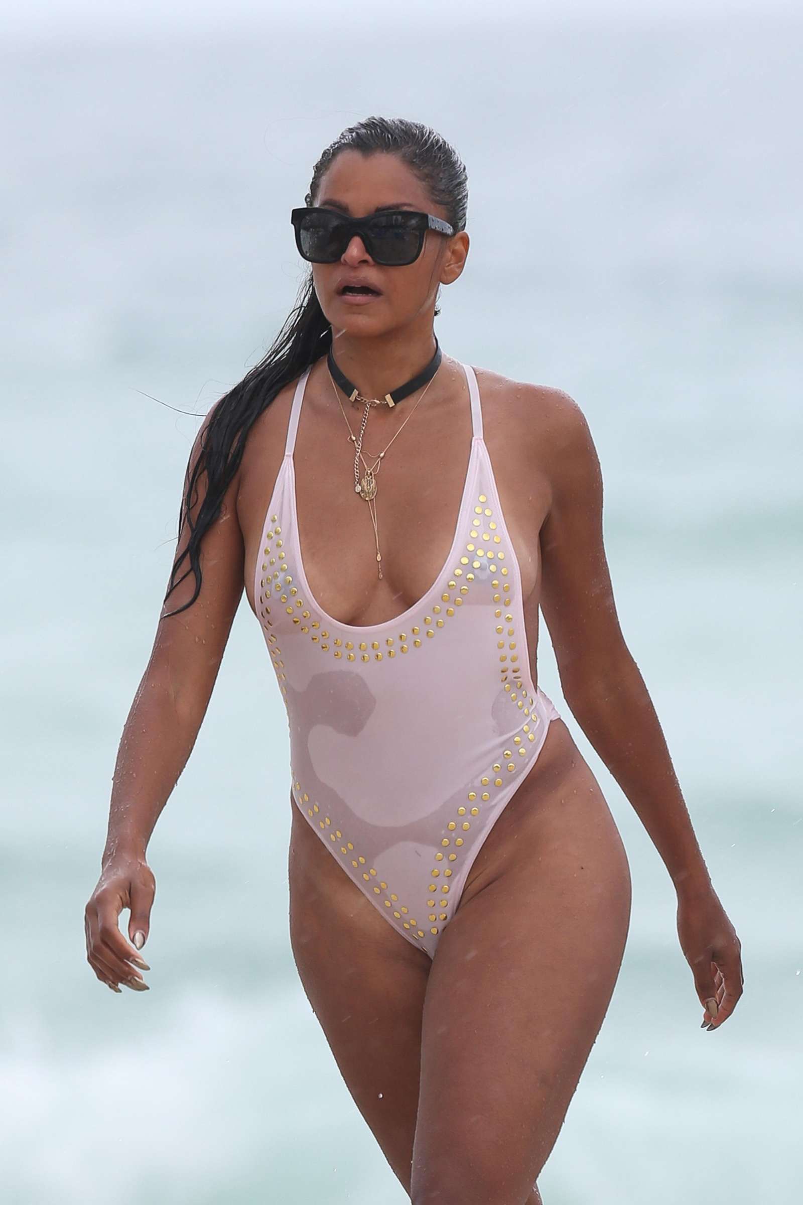Claudia Jordan in White Swimsuit on the beach in Miami | GotCeleb