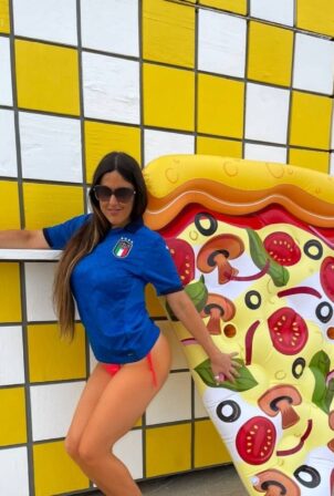 Claudia Romani - In a bikini on a giant pizza floatie in Miami
