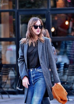 Dakota Johnson in Jeans and Coat in New York