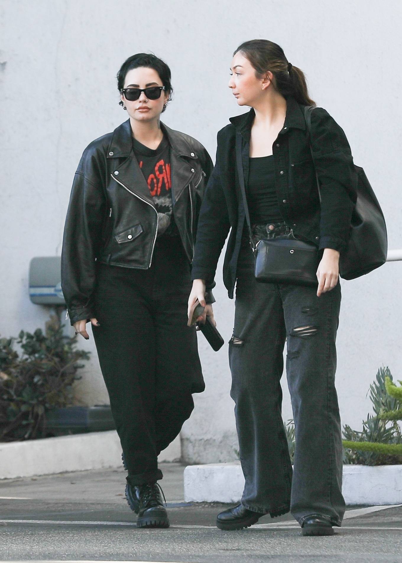 Demi Lovato - In a black leather jacket shopping on Rodeo Dr and Saks ...