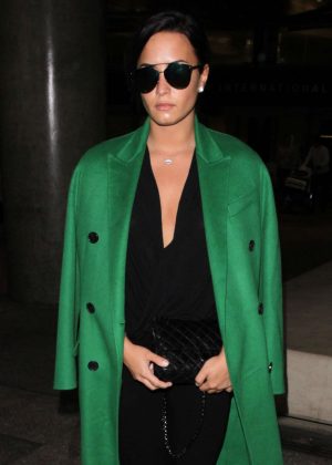 Demi Lovato in Green Coat Arrives to LAX in Los Angeles