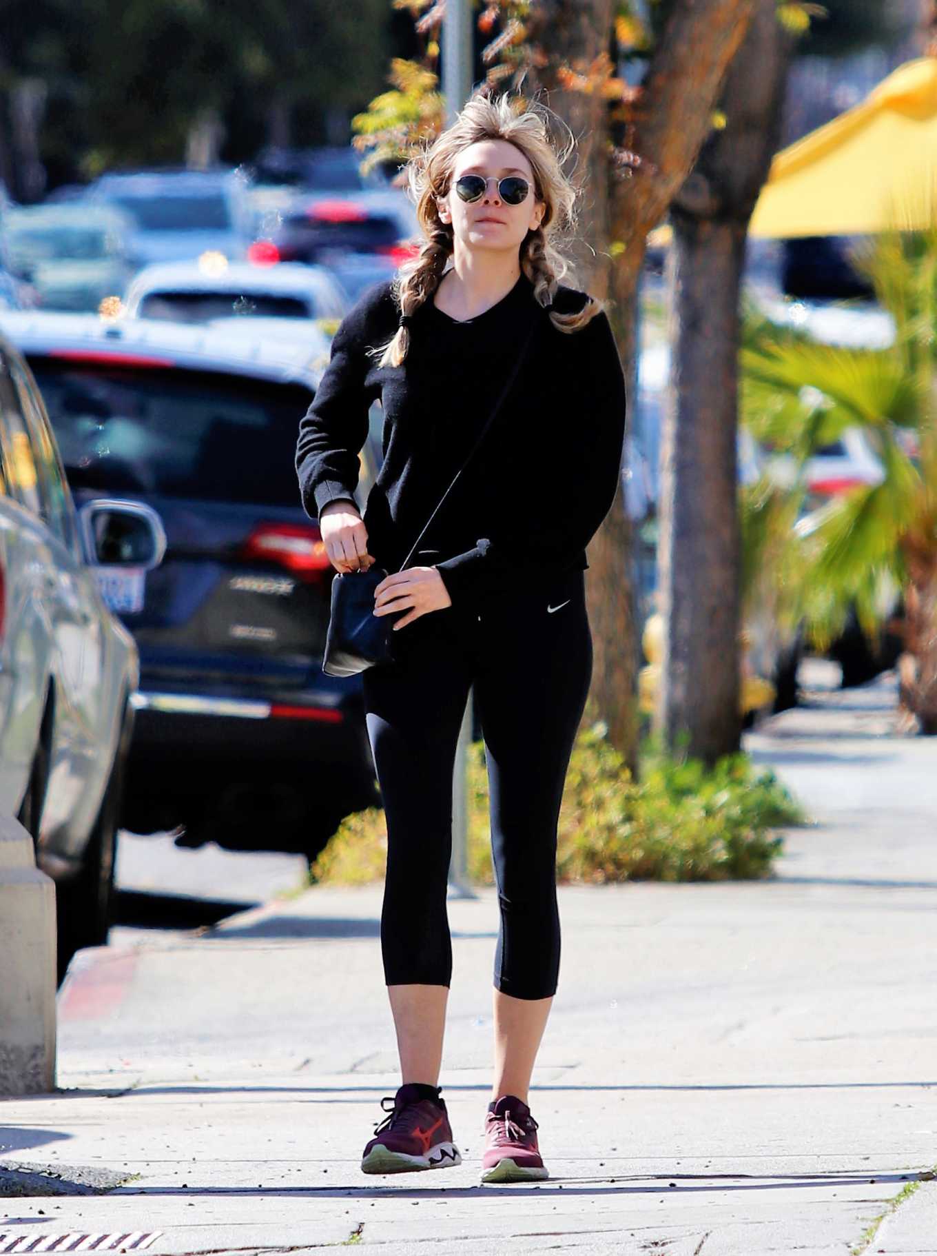 Elizabeth Olsen â€“ In a black Nike leggings out in Los Angeles