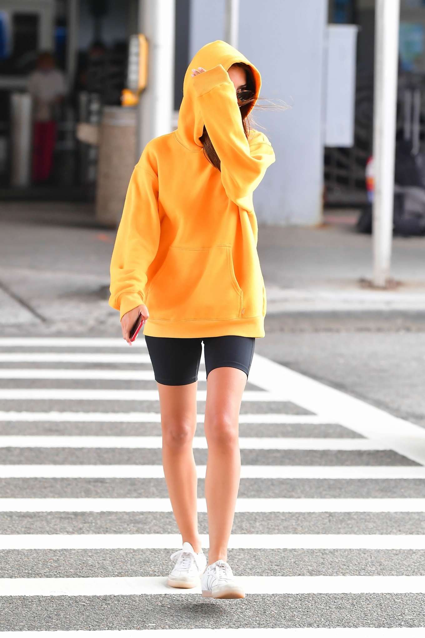 Emily Ratjakowski â€“ Wearing an orange hoody out in Brooklyn