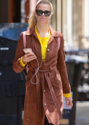 Hailey Clauson listens to music out in New York