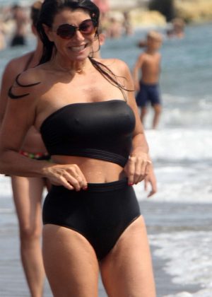 Ilaria D'amico in Black Bikini on the beach in Toscana
