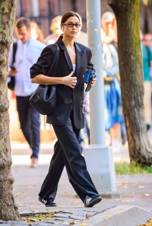 Irina Shayk - Wearing Adidas sneakers while exiting her New York home