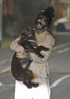 Jemma Lucy with her dog out for a late night walk in Manchster