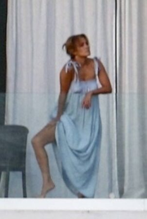Jennifer Lopez - Seen watching the sunset from the balcony of her Miami Beach waterfront mansion