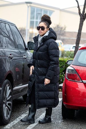 Jordyn Woods - In a puffer jacket and Coco Chanel full length boots in Calabasas