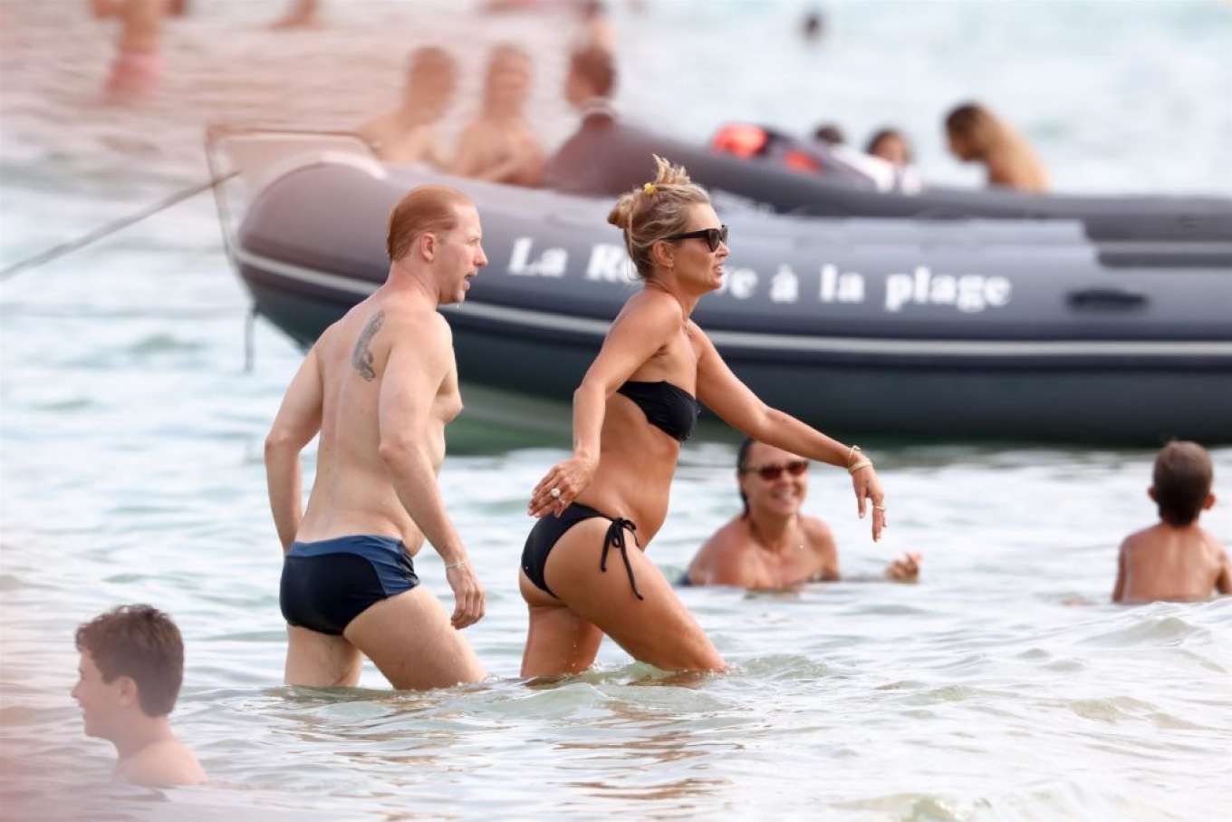 Kate Moss â€“ In black bikini in Saint-Tropez