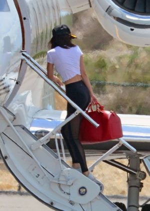Kendall Jenner in Tights at a private airport in Turks and Caicos