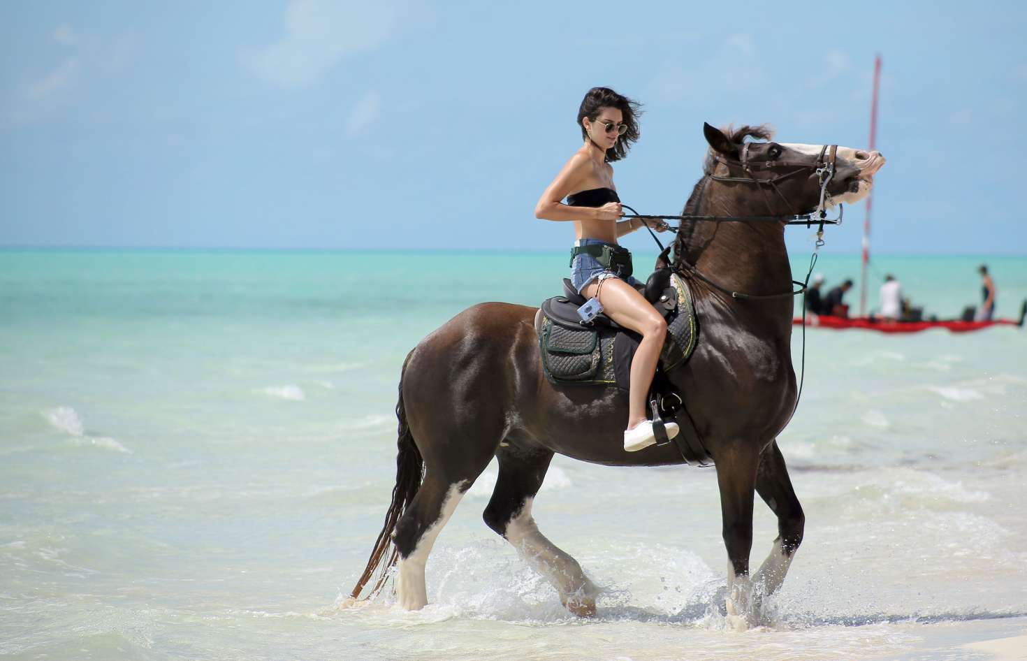 Kendall Jenner in Jeans Shorts at a beachwalk ride in Turks and Caicos. 