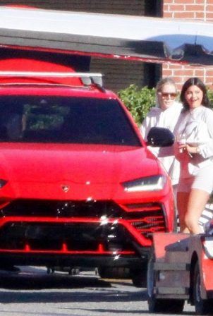 Kylie Jenner - pulls up to her private jet in a red Lamborghini in Los Angeles
