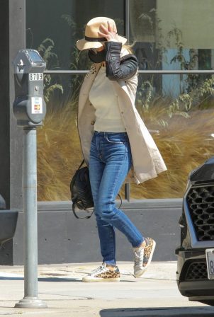 Laeticia Hallyday - In a long coat carrying a Gucci backpack purse in Beverly Hills