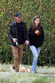Lily Collins with her boyfriend out taking her dog for a walk in Beverly Hills