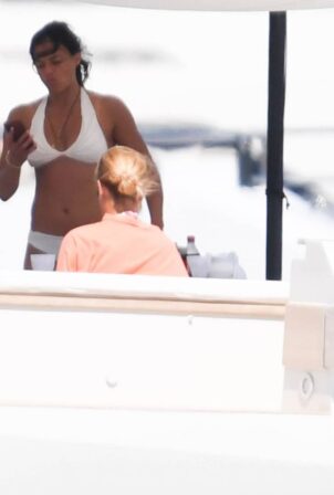 Michelle Rodriguez - In white bikini on holidays on a yacht in Porto Cervo