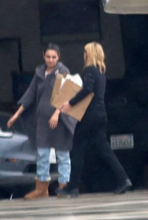 Mila Kunis - Returns home from a trip to Ashton's hometown in Iowa