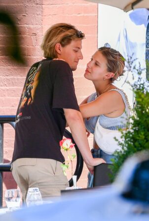 Millie Bobby Brown - Flashes a diamond ring while on the PDA with boyfriend Jake Bongiovi
