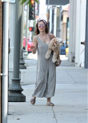 Minka Kelly with her dog out in La Quinta