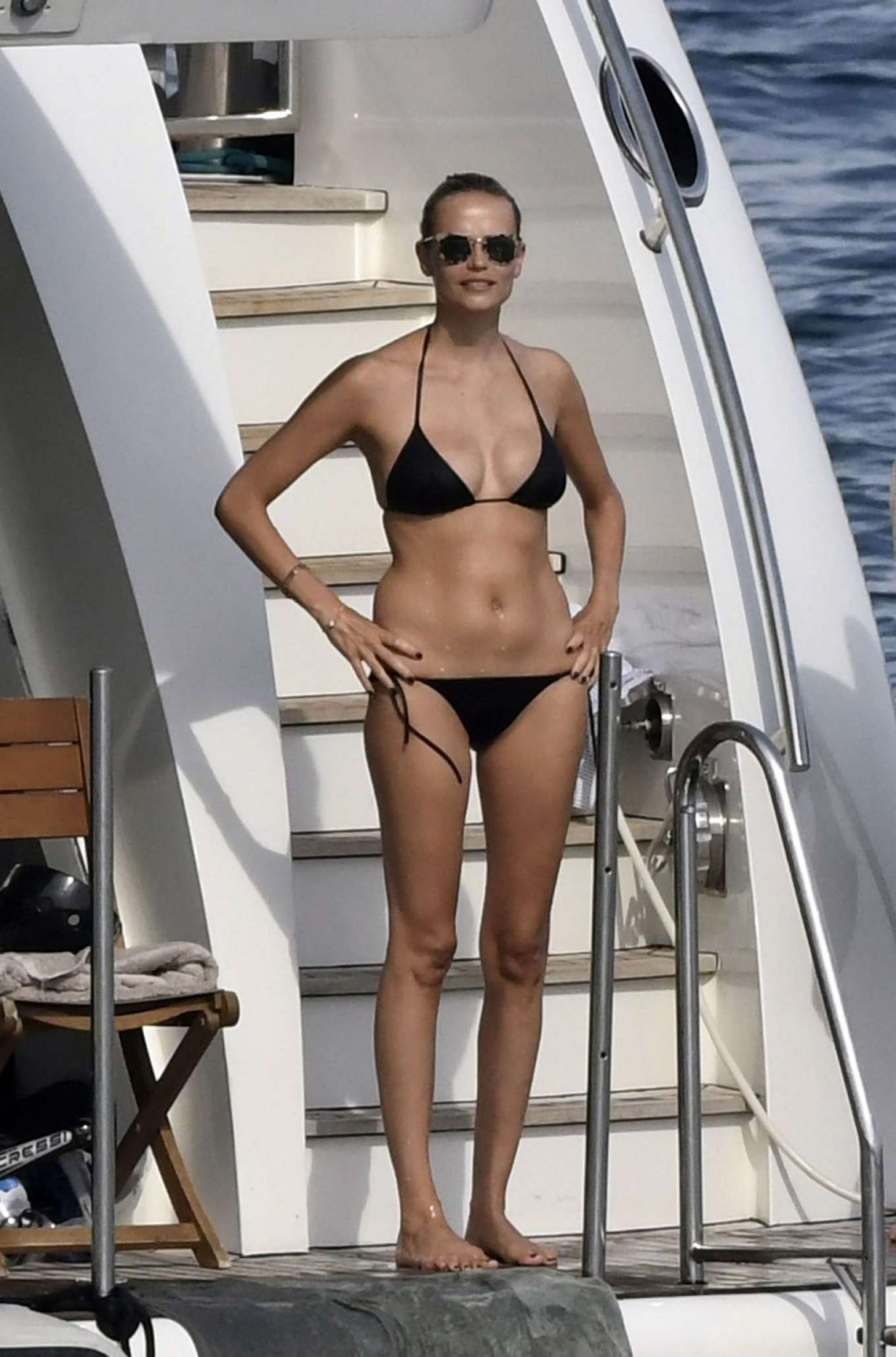 Natasha Poly in Black Bikini on a yacht in Sardinia | GotCeleb