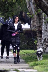 Nina Dobrev take her dog Maverick out for a walk