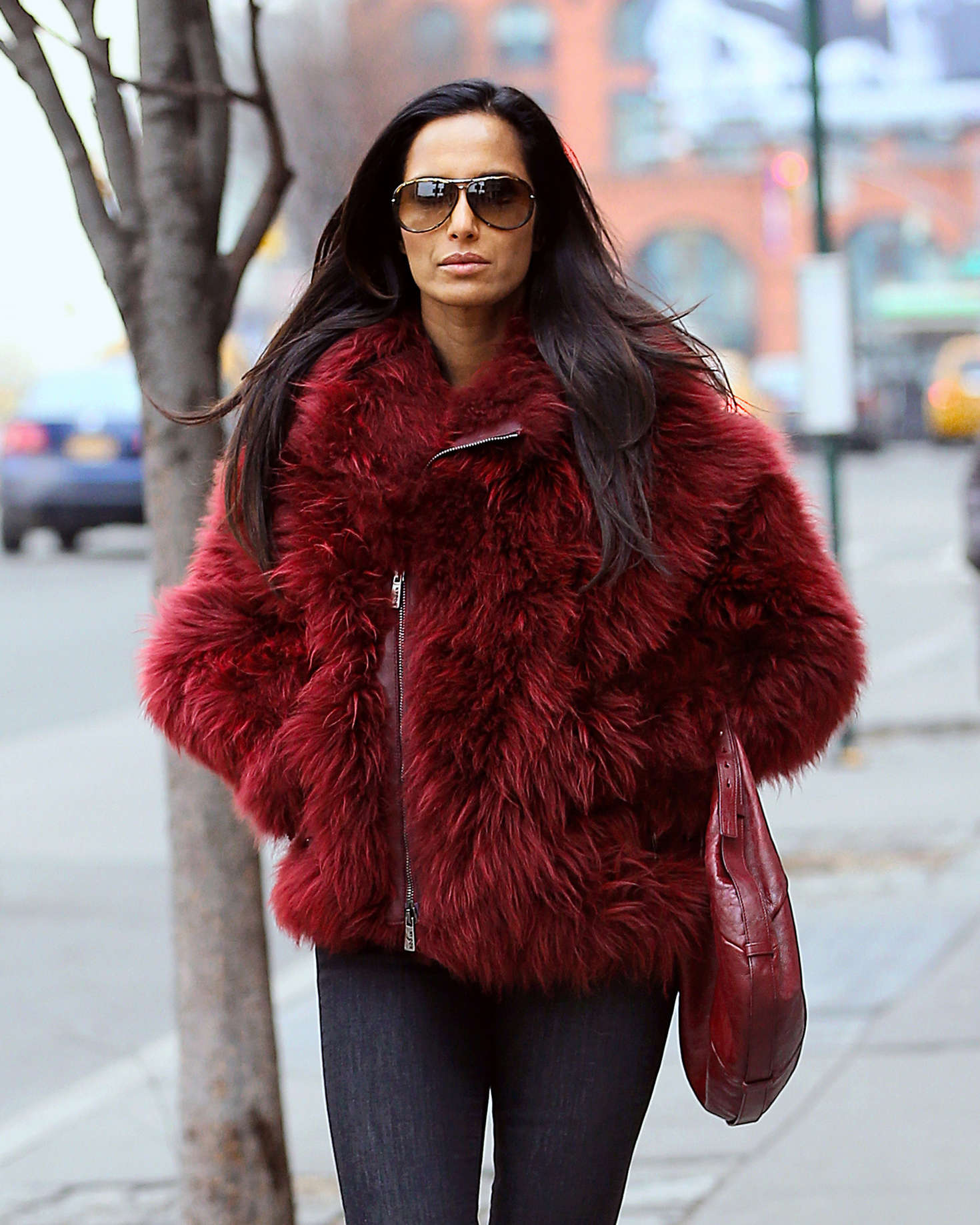 Padma Lakshmi in red fur coat out in NYC | GotCeleb