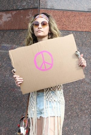 Paris Jackson - Holds a sign showing her support as she attends a protest in Los Angeles