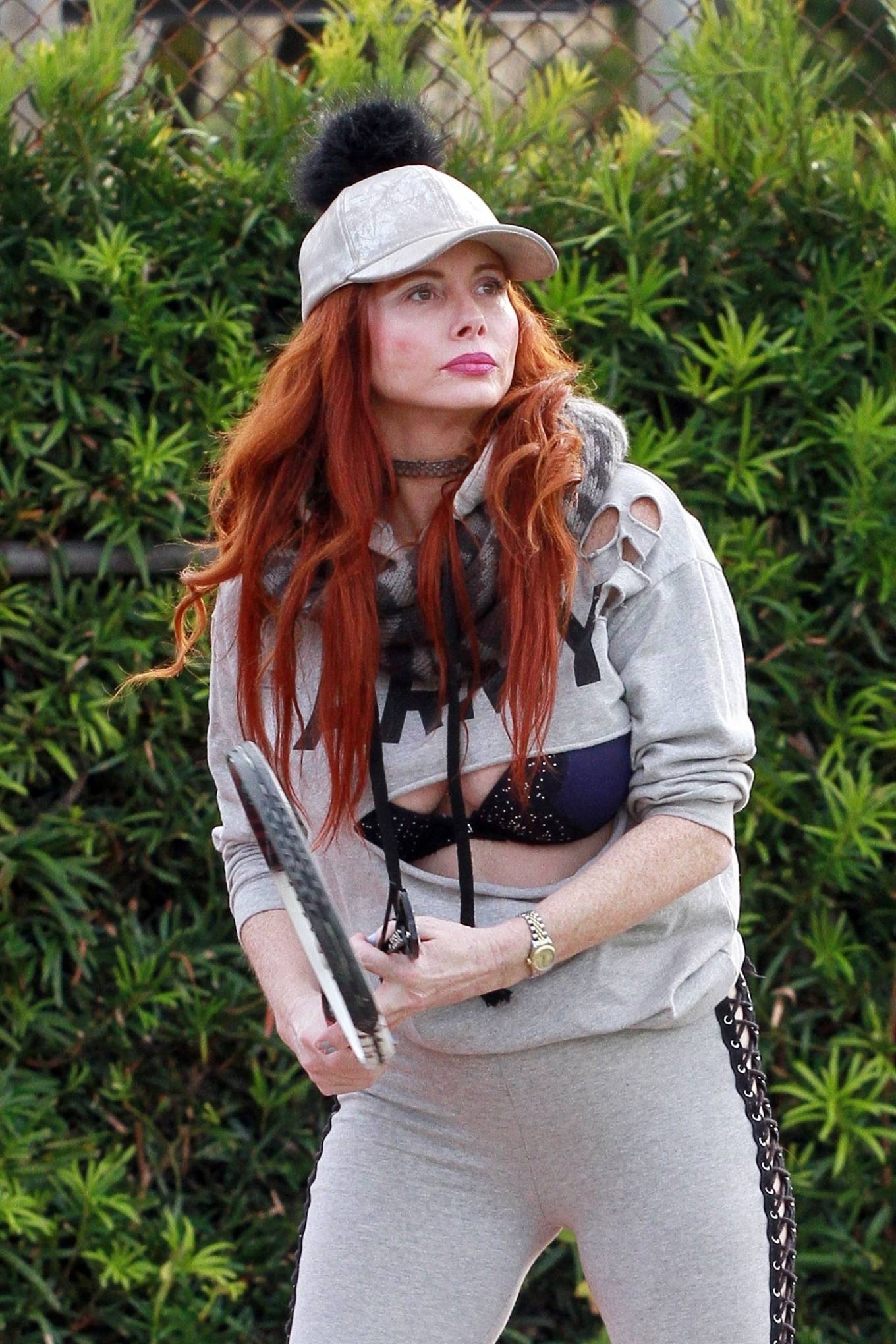 Phoebe Price – In a cut-up Army sweatshirt at the tennis court in Los Angeles