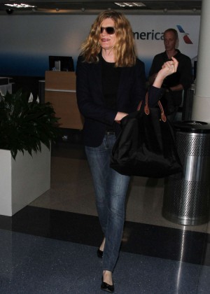 Rene Russo in Jeans at LAX Airport in LA