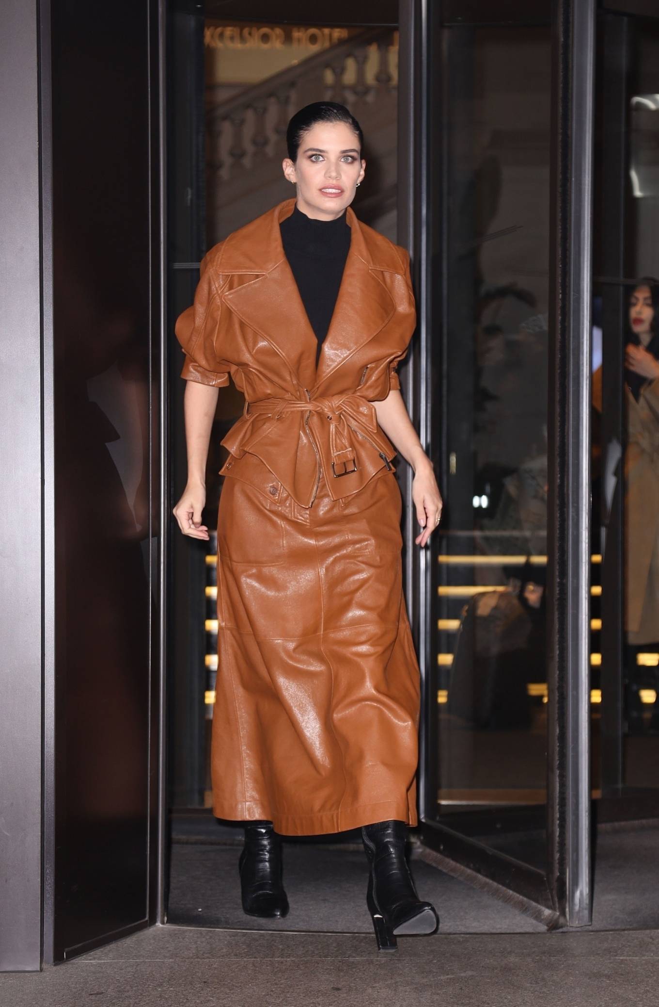 Sara Sampaio – In a brown leather trench coat during Milan Fashion Week