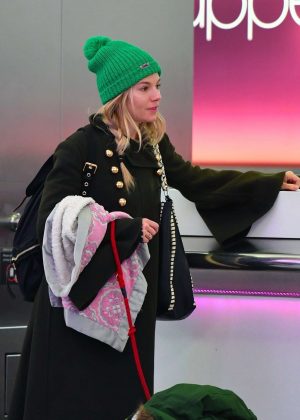 Sienna Miller at Heathrow Airport in London