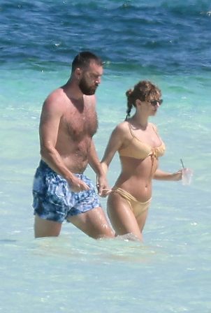 Taylor Swift - In a bikini With Travis Kelce seen at a beach getaway together