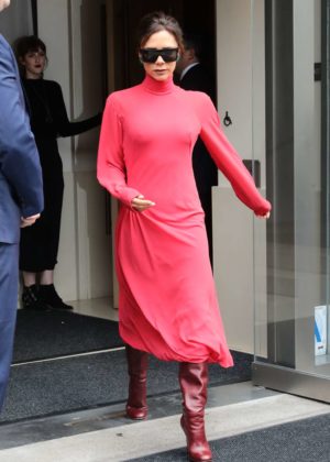 Victoria Beckham in red as she leaves her hotel in New York