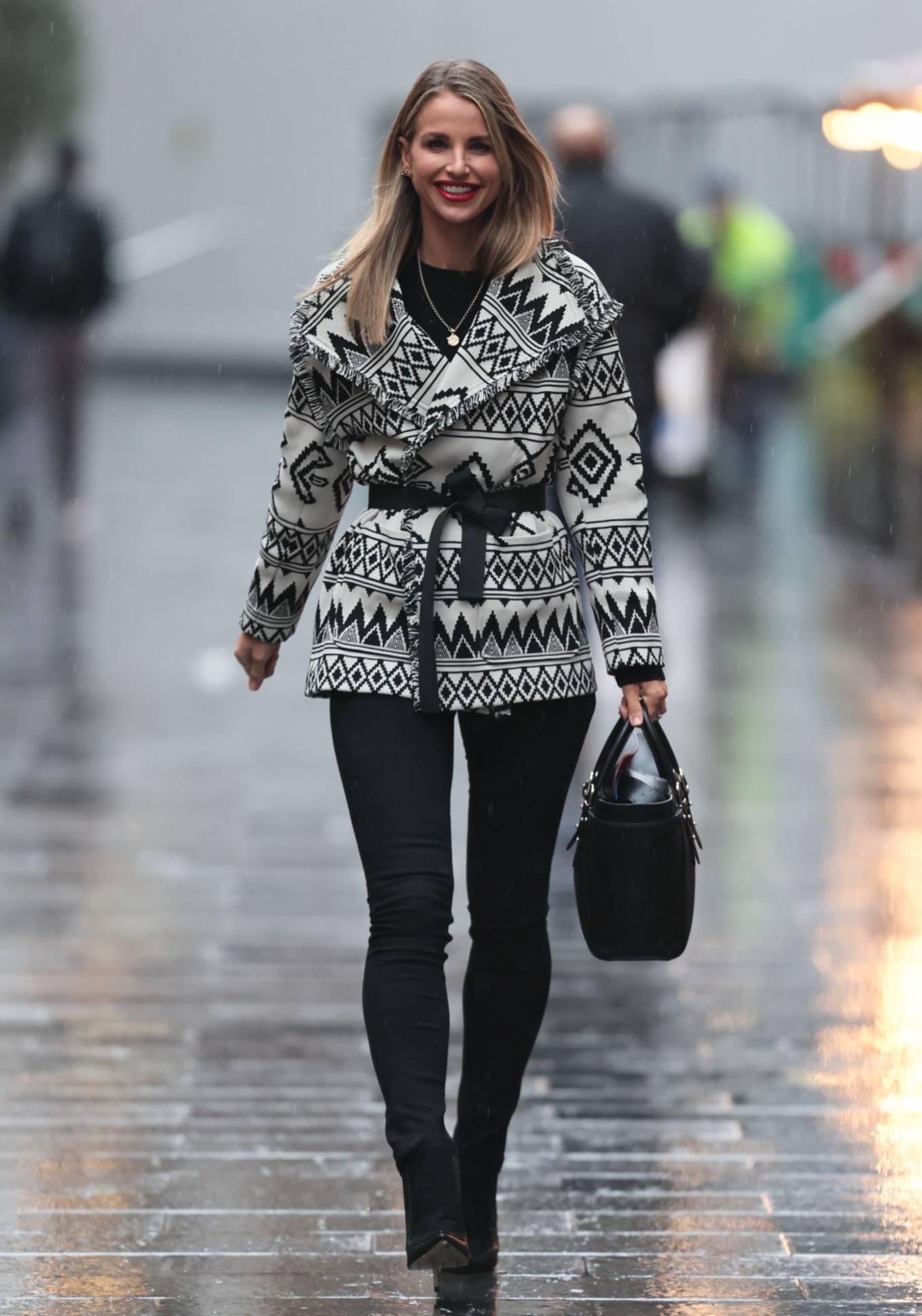 Vogue Williams – In geometric print jacket and denim trousers at Heart radio