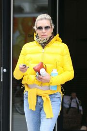 Yolanda Hadid in Yellow Puffer Jacket - Leaves Gigi's apartment in NYC