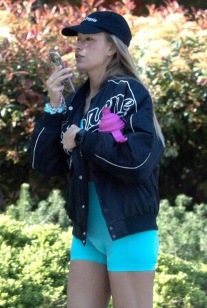Zara McDermott - Wearing a blue lycra bodysuit and Converse Trainers while out in London