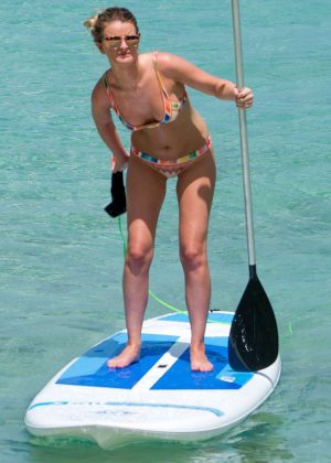 Zoe Salmon in Bikini Paddle boarding on the beach in Barbados